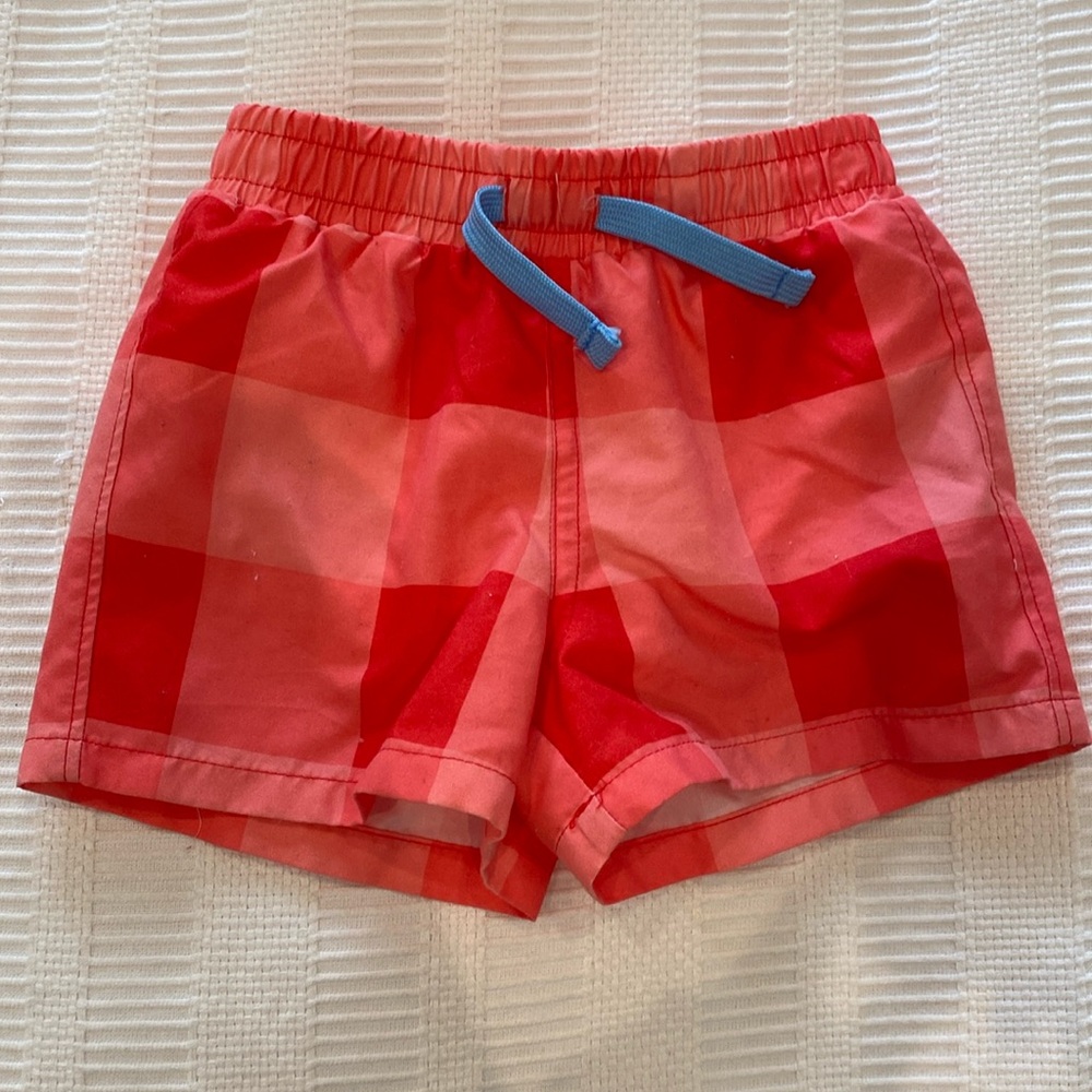 Primary Baby red swim trunk in gingham 6-12 months